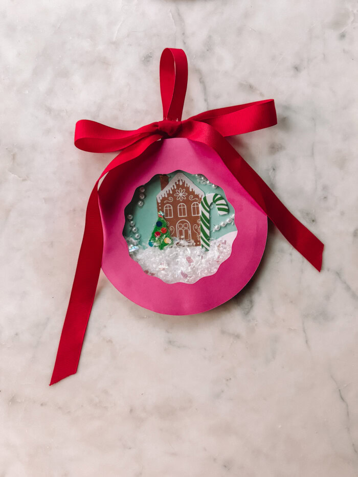 Pink paper plate snow globe