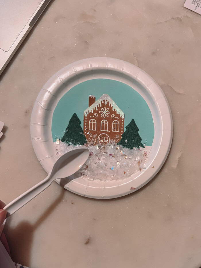 spooning snow onto plate