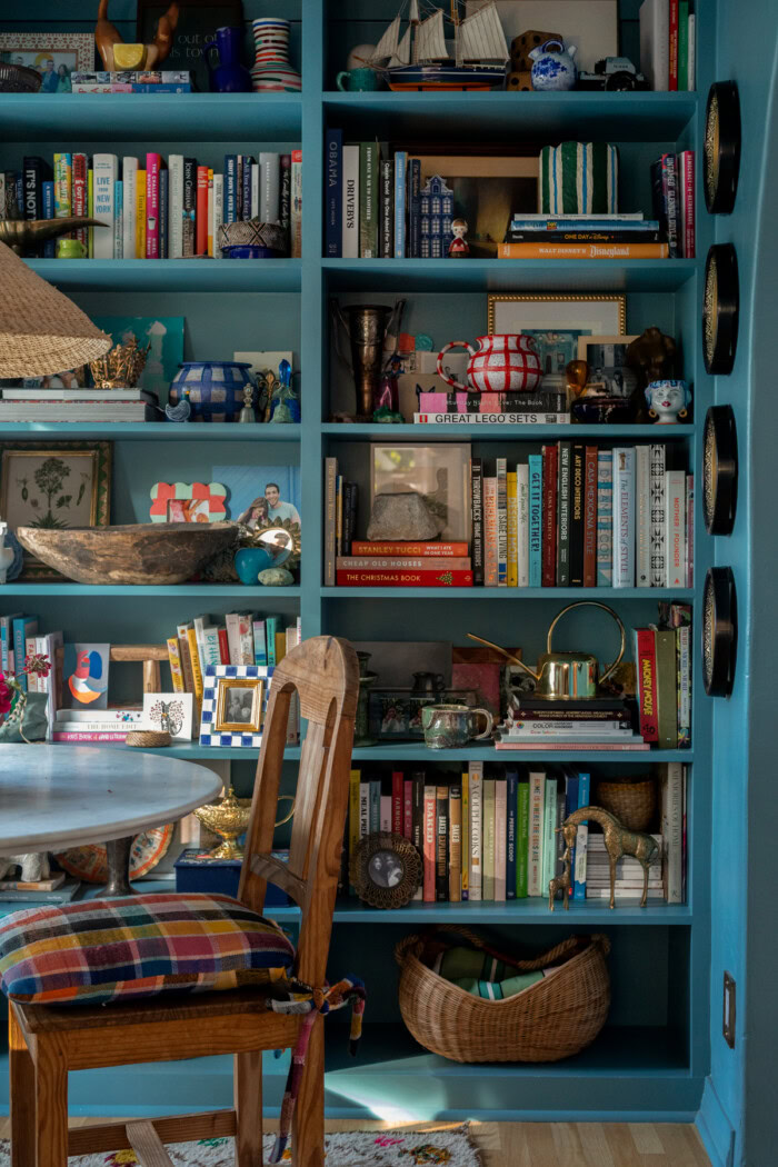 Bookshelves in blue dining room