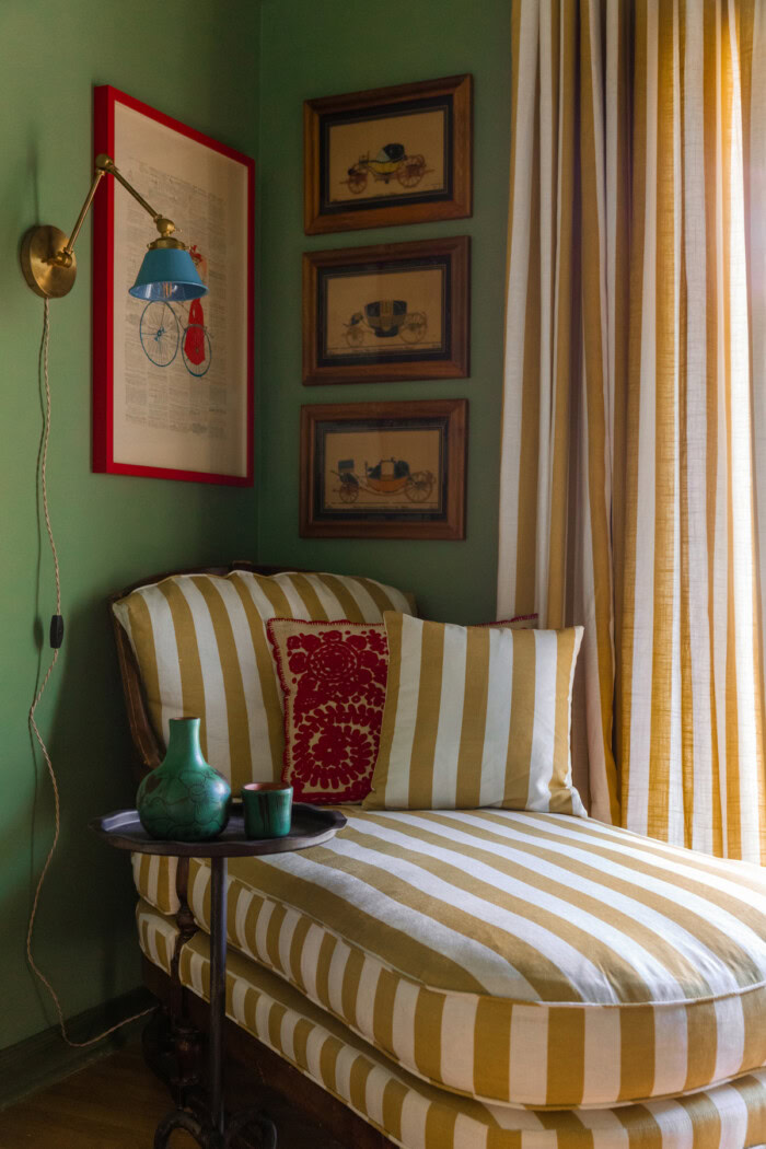 Blue sconce over chaise