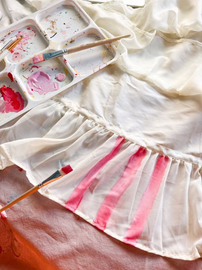 painting pink stripes on skirt